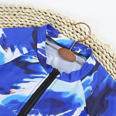 Maillot Rashguard Bleu Haut de Gamme pour Kite et Surf avec Motifs Oranges Subtils